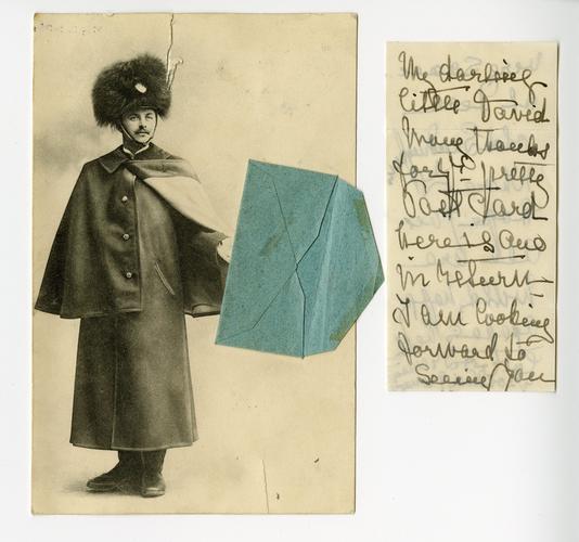 Postcard of a soldier holding an envelope Postcard of a soldier holding an envelope