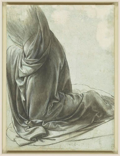 The drapery of a kneeling figure