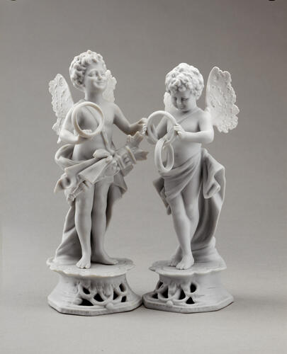 A pair of wedding cake ornaments