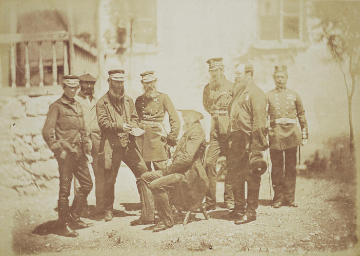 Group with seated officer in plain clothes