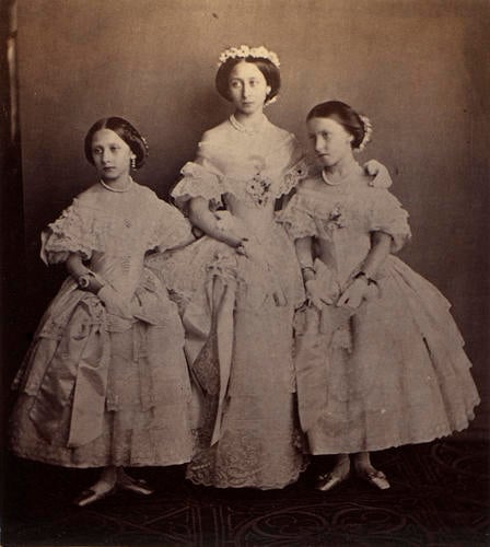 Princess Louise, Princess Alice and Princess Helena in the dresses they wore at the marriage of Victoria, the Princess Royal