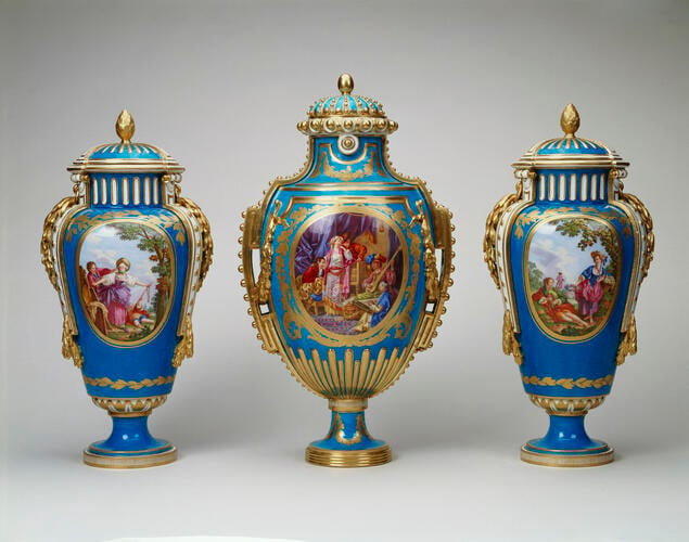 Garniture of three vases: (vase à Panneaux or vase à perles) and a pair of vases and covers (vase à bandes)