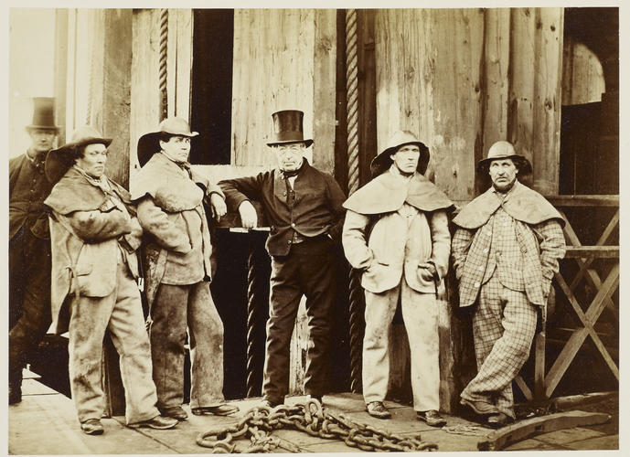 W. Coulson, Master Sinker, and four of his men. Pit Mouth, Hartley Colliery