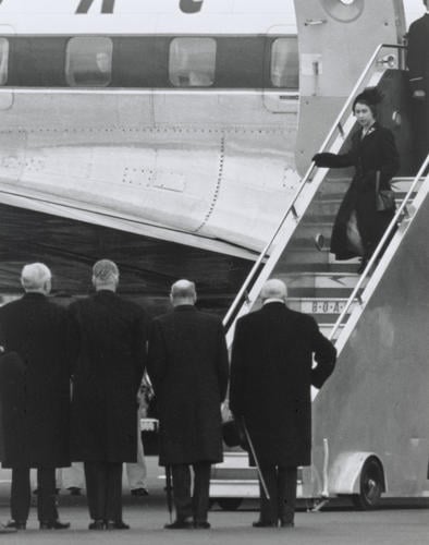 The Queen arriving at London Airport from Kenya, February 9th 1952, following the death of King George VI and her accession to her throne. She is met by Mr Churchill, Mr Attlee, Mr Eden & Lord Woolton