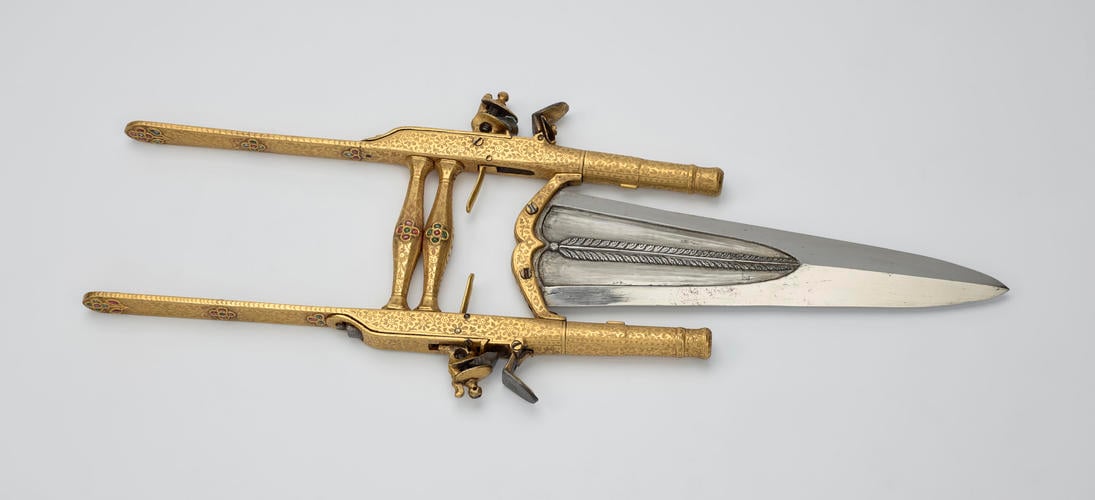 Punch dagger with pistols