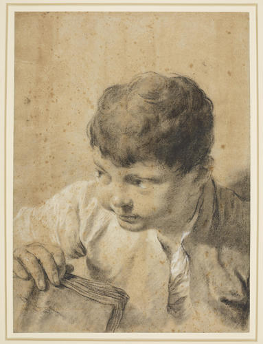 A portrait of a young boy with a book A portrait of a young boy with a book