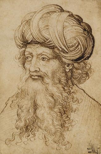 A head of a man wearing a turban