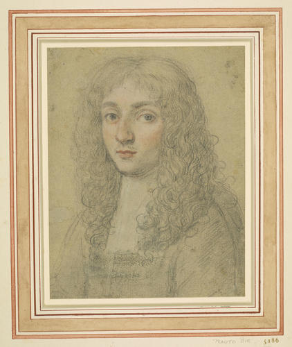 A portrait of a man with long hair