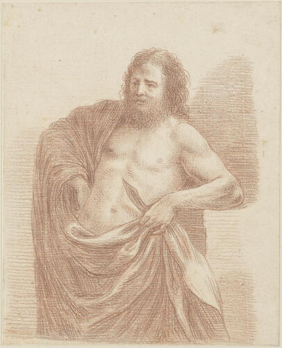 A bearded semi-nude man holding a knife A bearded semi-nude man holding a knife
