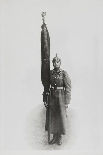 A Russian soldier holding a flag A Russian soldier holding a flag