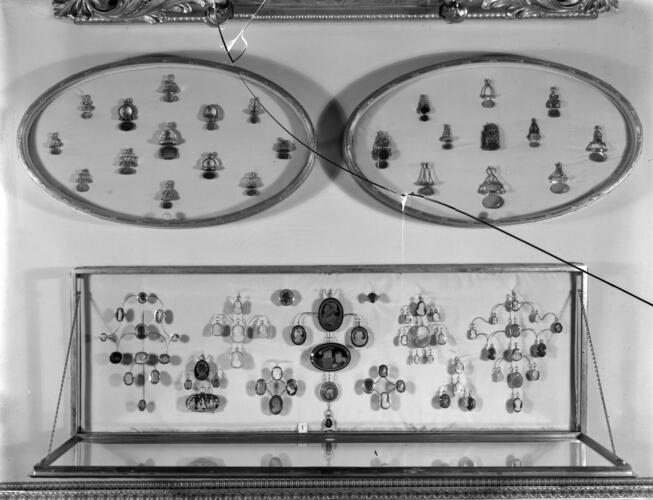 Glass plate negative of displays of rings and seals Glass plate negative of displays of rings and seals
