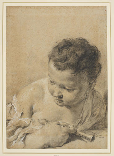 The head of a child holding a pipe