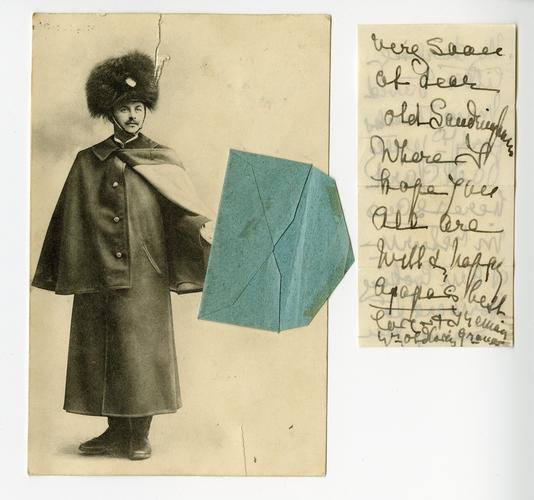 Postcard of a soldier holding an envelope Postcard of a soldier holding an envelope