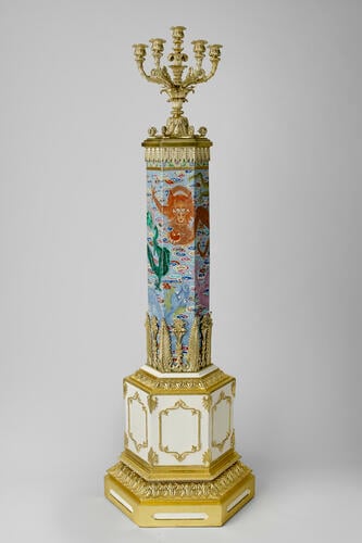 Four hexagonal columns mounted as stands for candelabra