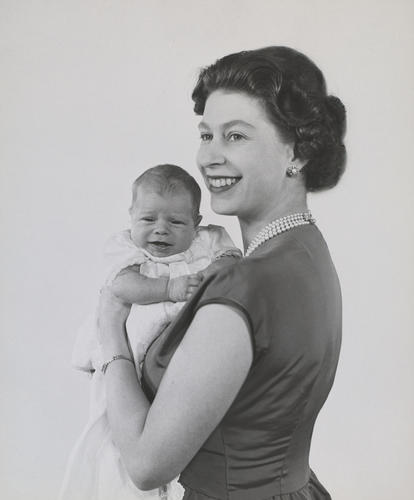 Queen Elizabeth II holding an infant Prince Andrew