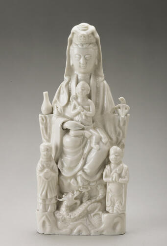 Guanyin with a child enthroned with acolytes