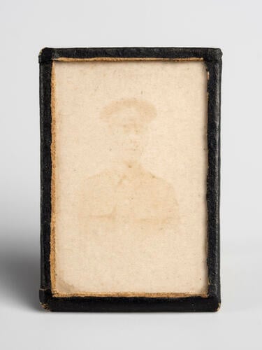 Miniature portrait of an unidentified man wearing First World War uniform. [Queen Mary's Doll's House]