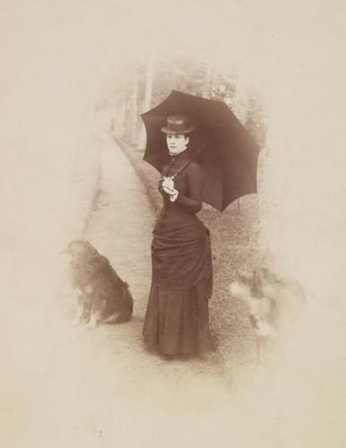 Portrait photograph of the Princess of Wales (1844-1925), later Queen Alexandra with two dogs, c. 1880