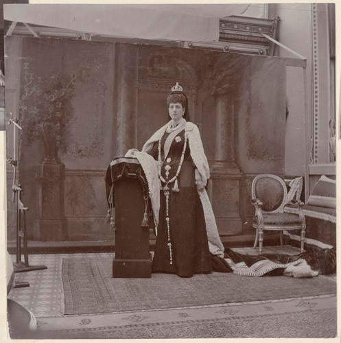 Master: Page 23 of Princess Victoria's album: photographs of King Edward VII and Queen Alexandra, dressed for the State Opening of Parliament, February 1901
Item: Photograph of Queen Alexandra, dressed for the State Opening of Parliament, February 1901