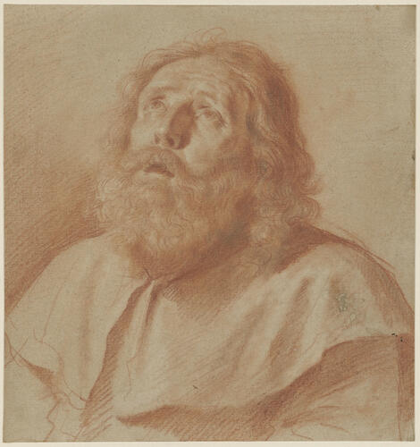 A bearded man looking upwards A bearded man looking upwards