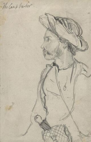 A portrait of a man identified as the camp barber A portrait of a man identified as the camp barber