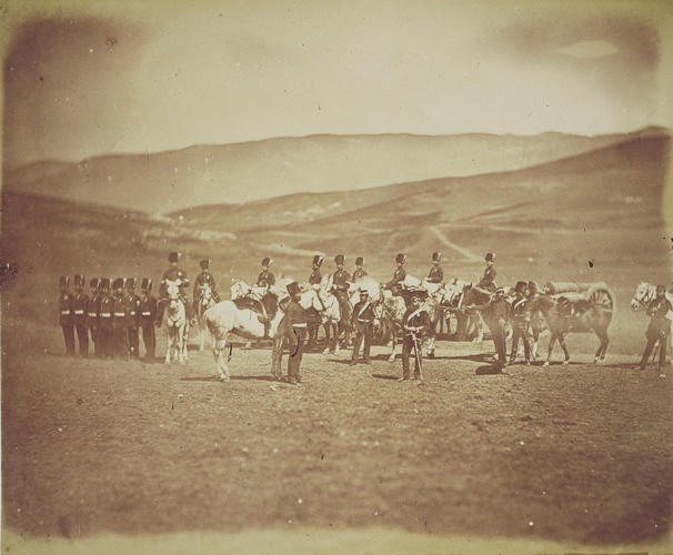 Small group of men drawn up in a line, other men mounted on horses, in open country [taken from contents list]. [Crimean War photographs by Robertson 1855]