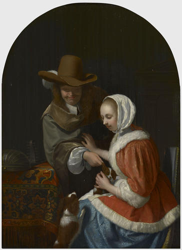 A Man Pulling a Lapdog's Ear in a Woman's Lap