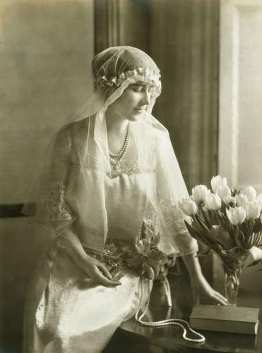 Lady Elizabeth Bowes Lyon in the dress she wore as a bridesmaid at the marriage of HRH Princess Mary and Viscount Lascelles, 28 February 1922
