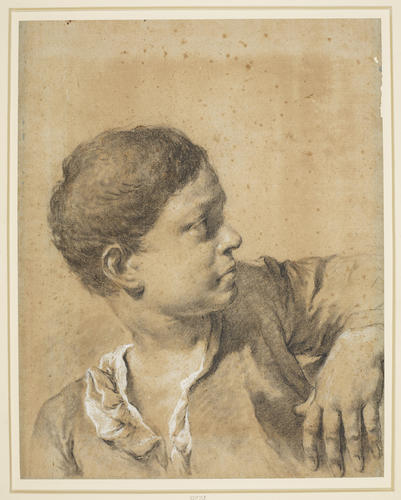 The head of a boy in profile to the right The head of a boy in profile to the right