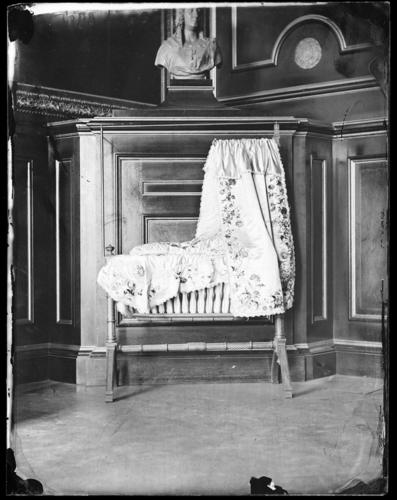 Glass plate negative of a baby's cradle Glass plate negative of a baby's cradle