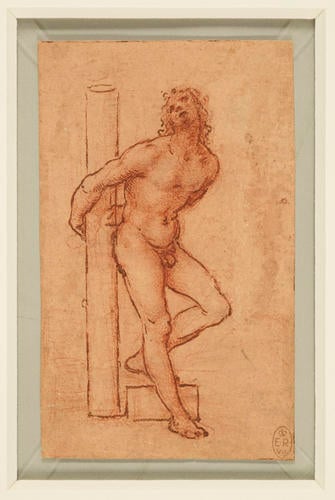 A nude young man bound to a column