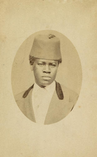 Unidentified youth wearing a fez Unidentified youth wearing a fez