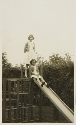 Princesses Elizabeth and Margaret on a slide