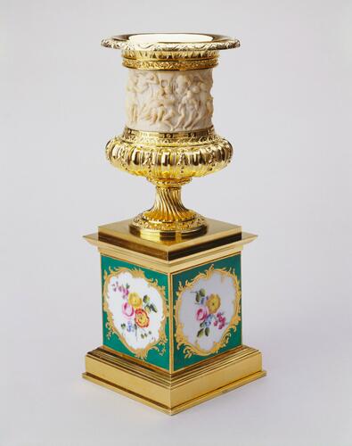 Ivory and silver-gilt urn on a porcelain pedestal (caisse carrée)