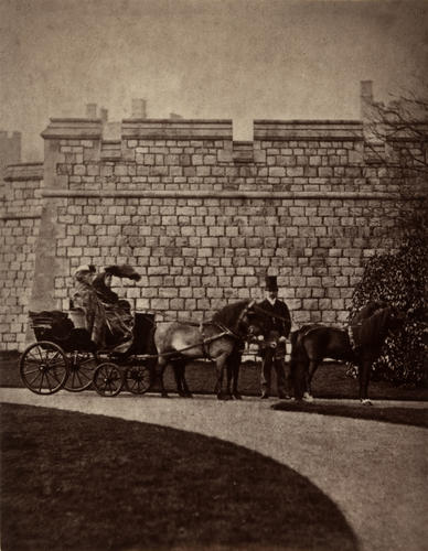 Photograph showing Queen Victoria (1819-1901) in a horse drawn carriage at Windsor Castle