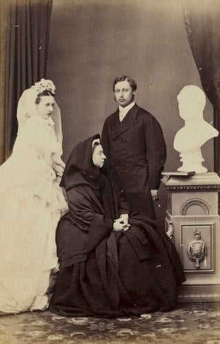 Queen Victoria and the Prince and Princess of Wales with bust of Prince Albert