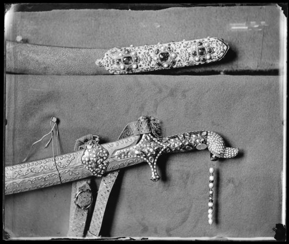 Glass plate negative of sword hilt and scabbard tip Glass plate negative of sword hilt and scabbard tip