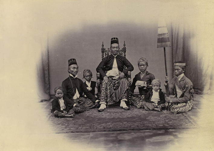 Malay temple priest and followers Malay temple priest and followers