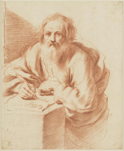 A bearded man writing A bearded man writing