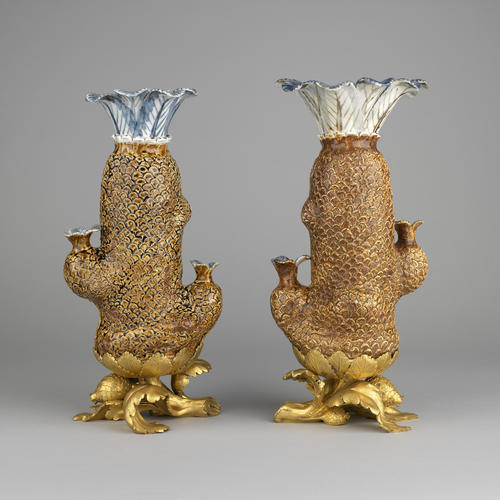Pair of cycad palm vases with mounts