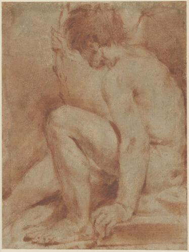 A nude man seated on the ground A nude man seated on the ground