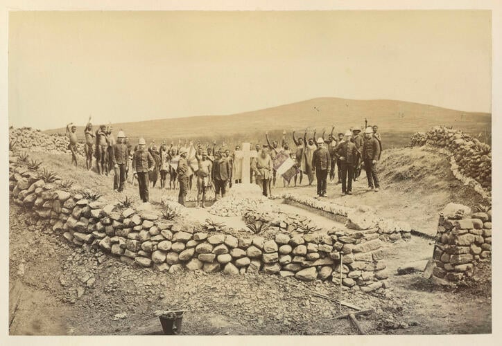 Men gathered around the memorial to commemorate the death of Napoléon, Prince Imperial of the French