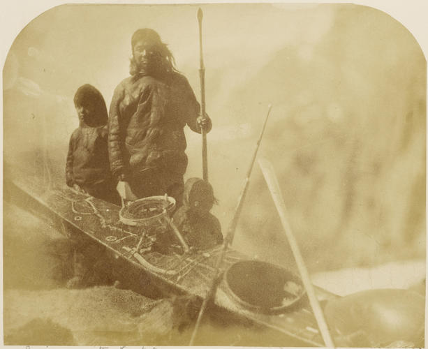 An Inuit man with Kyac and children