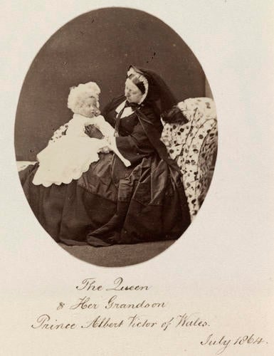 Photograph of Queen Victoria (1819-1901) seated with her grandson, Prince Albert Victor (1863-92), later the Duke of Clarence and Avondale