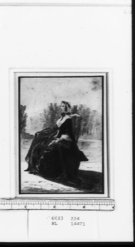 A lady seated in a park