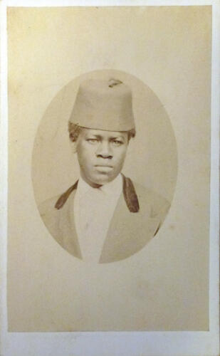Unidentified youth wearing a fez Unidentified youth wearing a fez