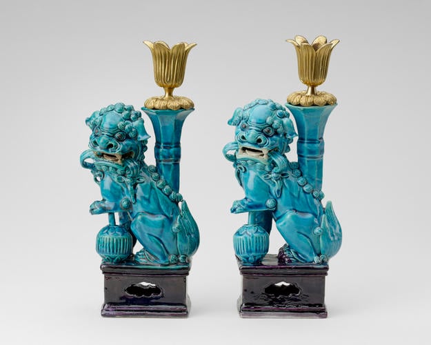 Two lions mounted as candlesticks