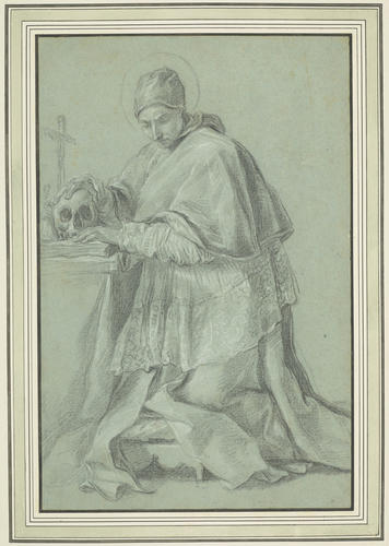 A priest in prayer before a skull and a crucifix A priest in prayer before a skull and a crucifix