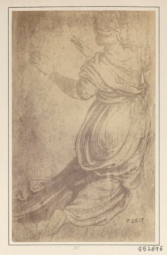 A kneeling woman seen from behind