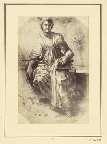 A seated female figure